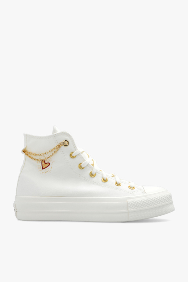 Cream fashion and gold converse